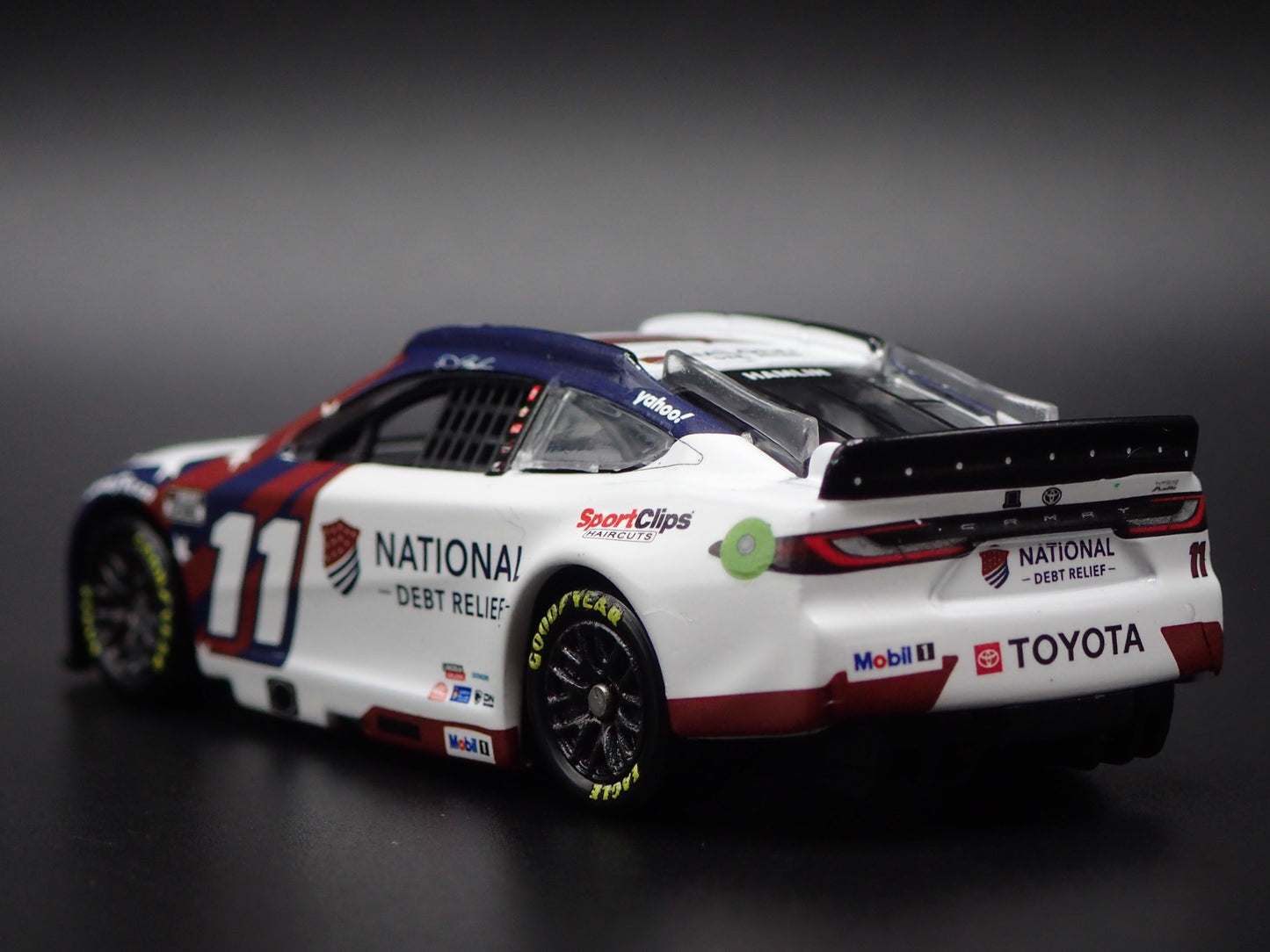2025 25 TOYOTA CAMRY 11 DENNY HAMLIN DEBT RELIEF NASCAR 1:64 SCALE DIECAST CAR