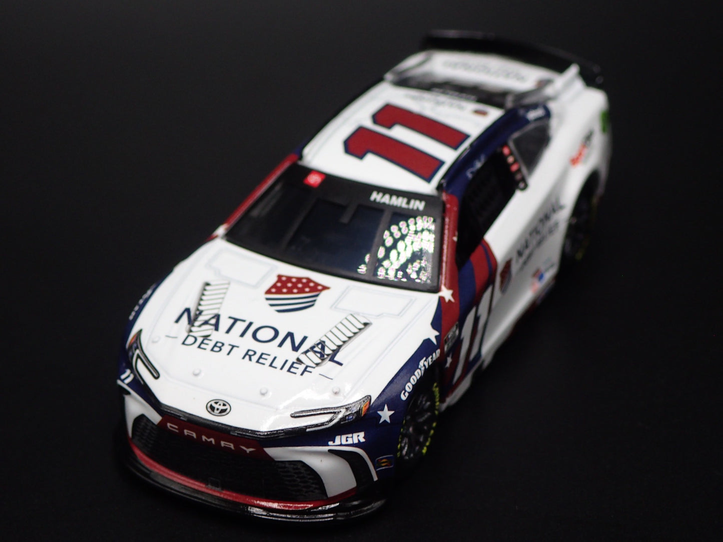 2025 25 TOYOTA CAMRY 11 DENNY HAMLIN DEBT RELIEF NASCAR 1:64 SCALE DIECAST CAR