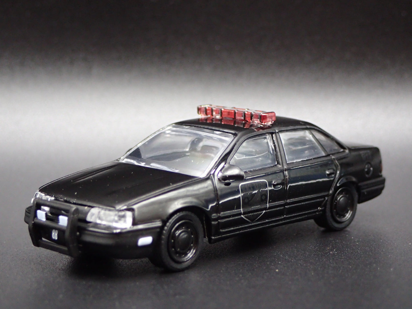 1986-1991 FORD TAURUS POLICE CAR 4 FOUR DOOR BLACK 1:64 SCALE DIECAST MODEL CAR