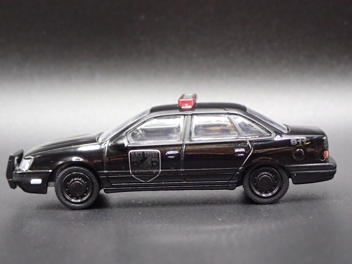 1986-1991 FORD TAURUS POLICE CAR 4 FOUR DOOR BLACK 1:64 SCALE DIECAST MODEL CAR
