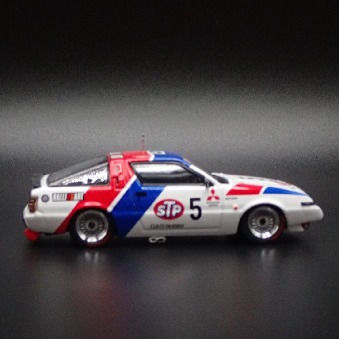 1983-1989 MITSUBISHI STARION STP ADVAN JDM 1:64 SCALE DIORAMA DIECAST MODEL CAR