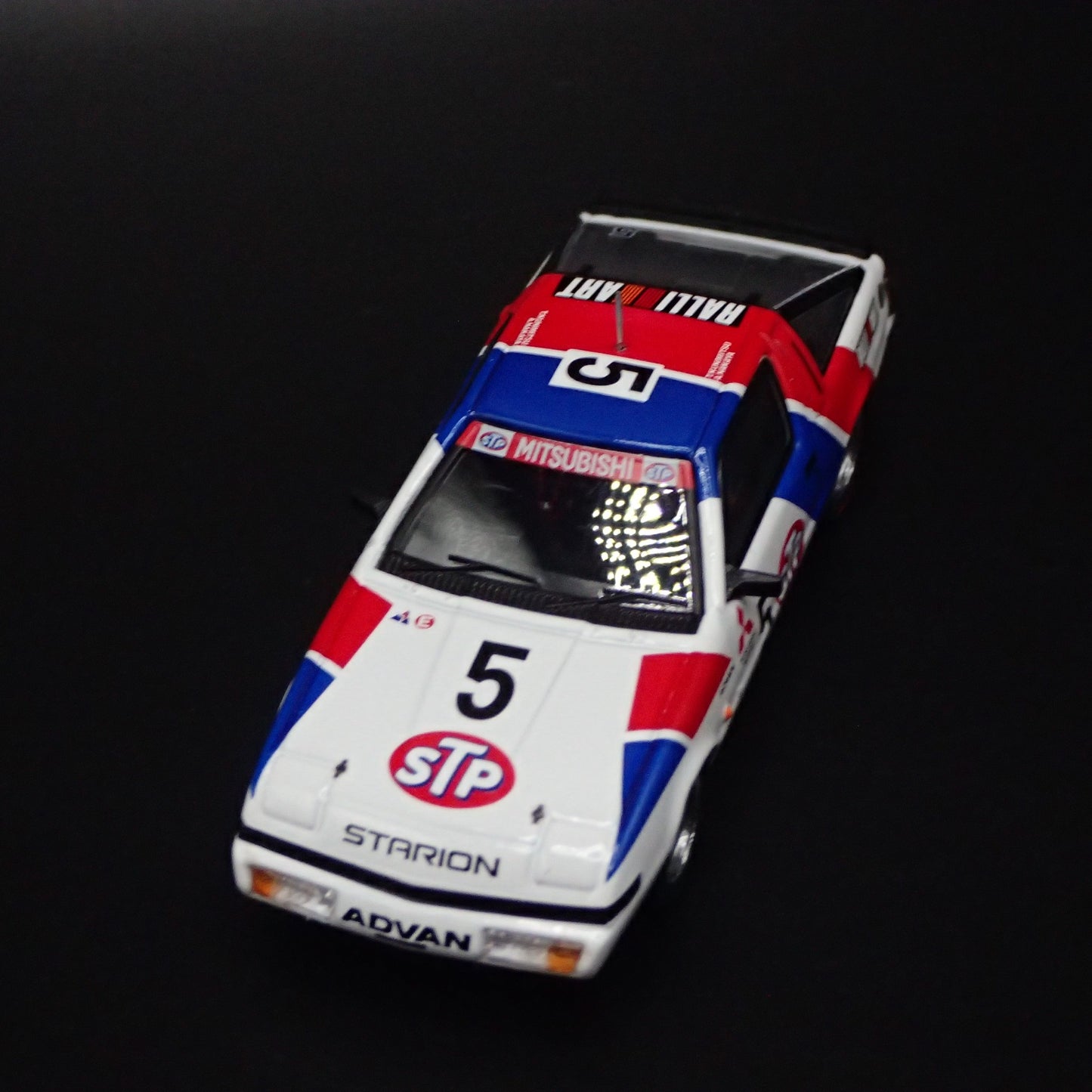 1983-1989 MITSUBISHI STARION STP ADVAN JDM 1:64 SCALE DIORAMA DIECAST MODEL CAR