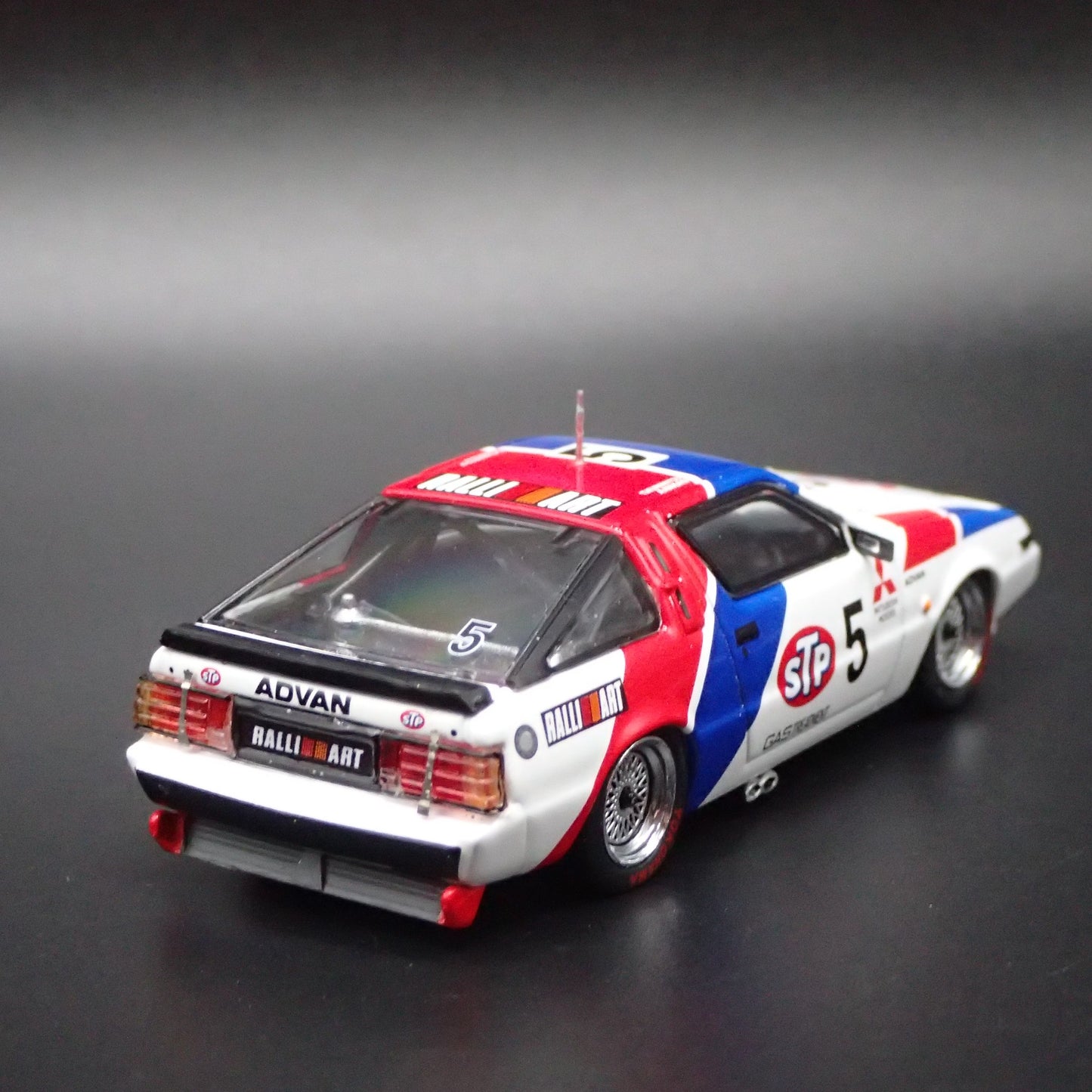 1983-1989 MITSUBISHI STARION STP ADVAN JDM 1:64 SCALE DIORAMA DIECAST MODEL CAR