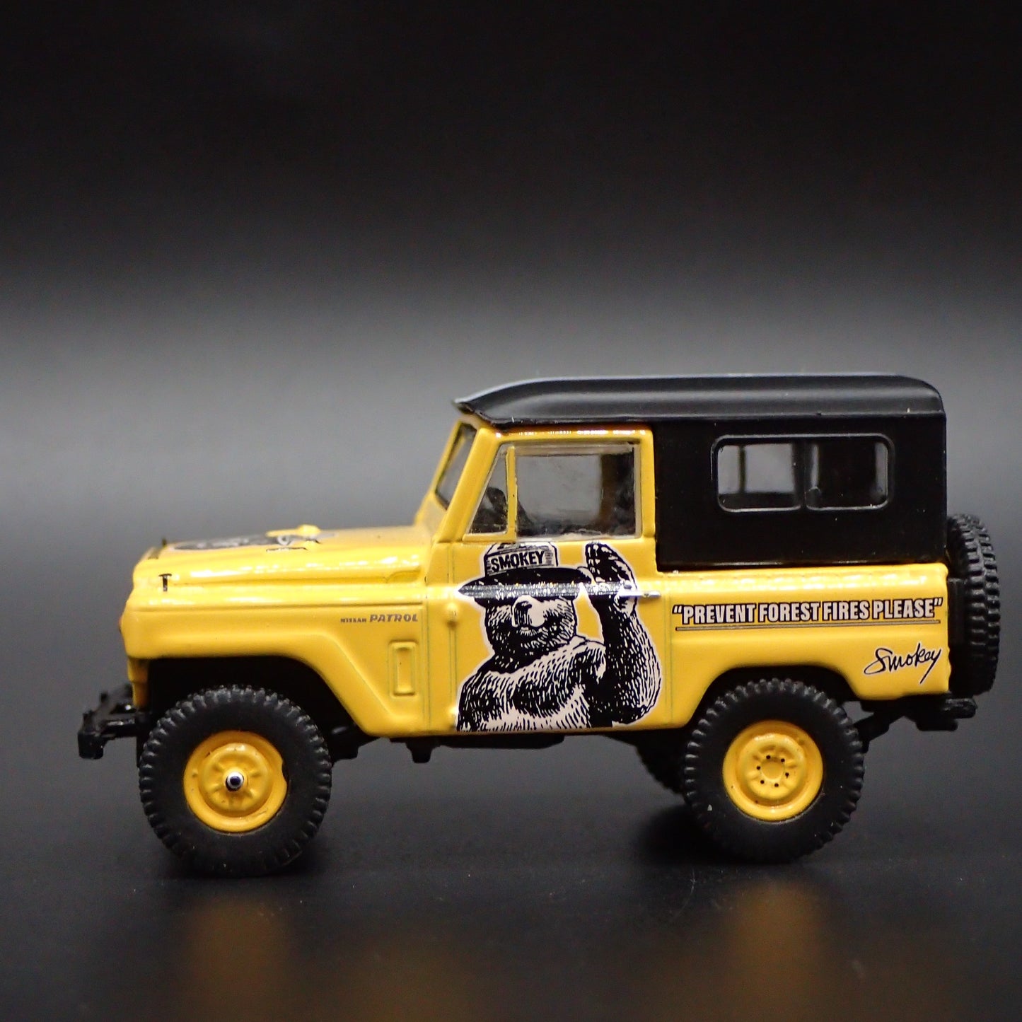 1960-1980 NISSAN PATROL SUV TRUCK SMOKEY BEAR 1:64 SCALE DIECAST MODEL CAR