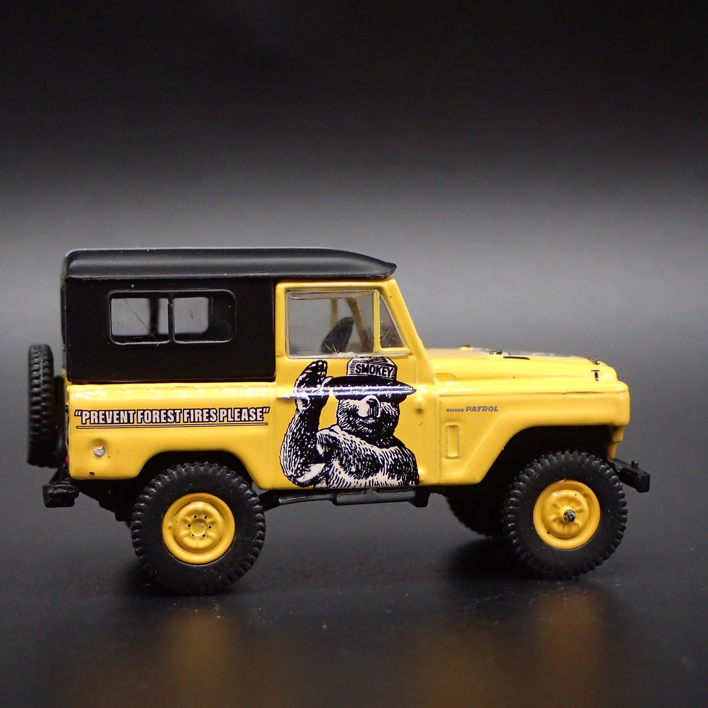 1960-1980 NISSAN PATROL SUV TRUCK SMOKEY BEAR 1:64 SCALE DIECAST MODEL CAR