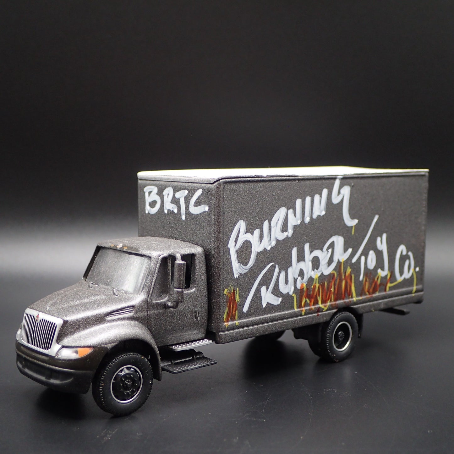 INTERNATIONAL DURASTAR BOX VAN TRUCK BURNING RUBBER 1/64 SCALE DIECAST MODEL CAR