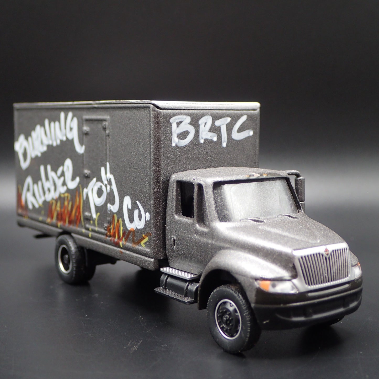 INTERNATIONAL DURASTAR BOX VAN TRUCK BURNING RUBBER 1/64 SCALE DIECAST MODEL CAR